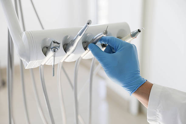 Professional Tooth Extraction technician working in Falls Church, VA